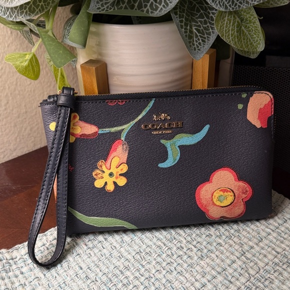 Coach Handbags - COACH Navy Floral Leather Wristlet with Multicolor Blooms